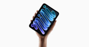 The new iPad mini with OLED display held in the palm of a hand