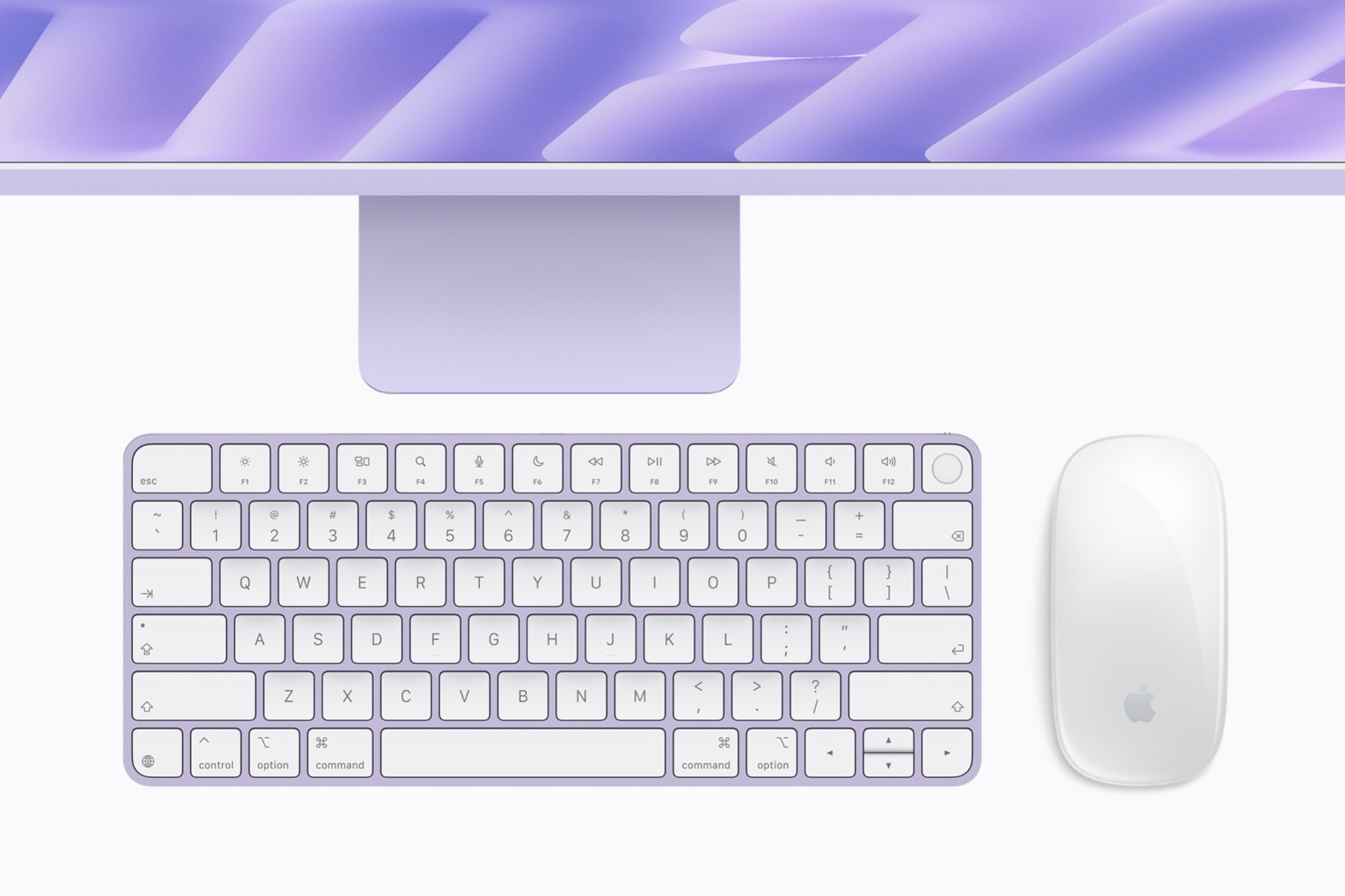 Color-matched Magic Keyboard and Magic Mouse below a purple iMac with M6
