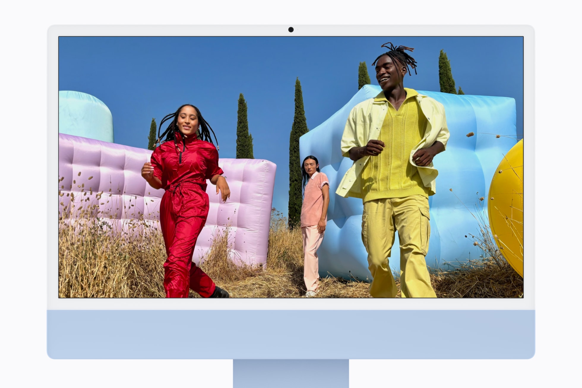 Blue iMac with M6 showing a photo on its 24-inch 4.5K display