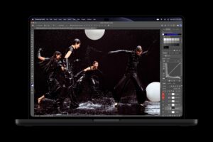 MacBook Pro with PROLED XDR Display showing the Photoshop app on the tandem OLED screen